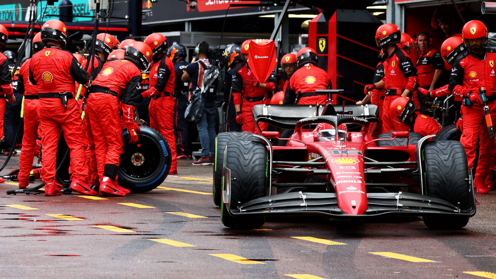 Ferrari driver Charles Leclerc swaps full wet tyres for intermediates. Monaco May 2022