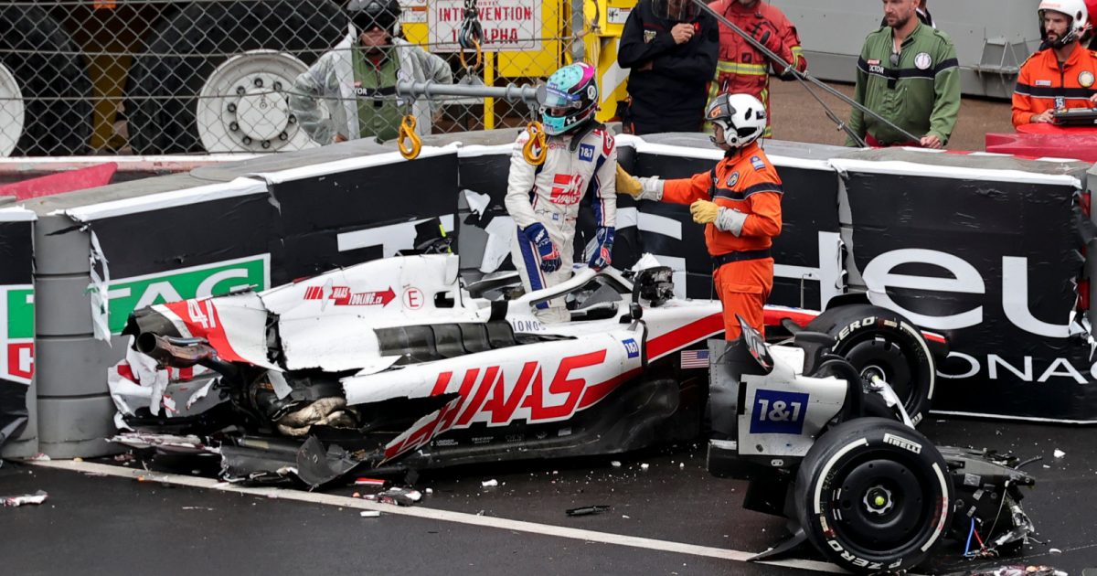 Mick Schumacher climbs from his wrecked Haas, rear missing. Monaco May 2022
