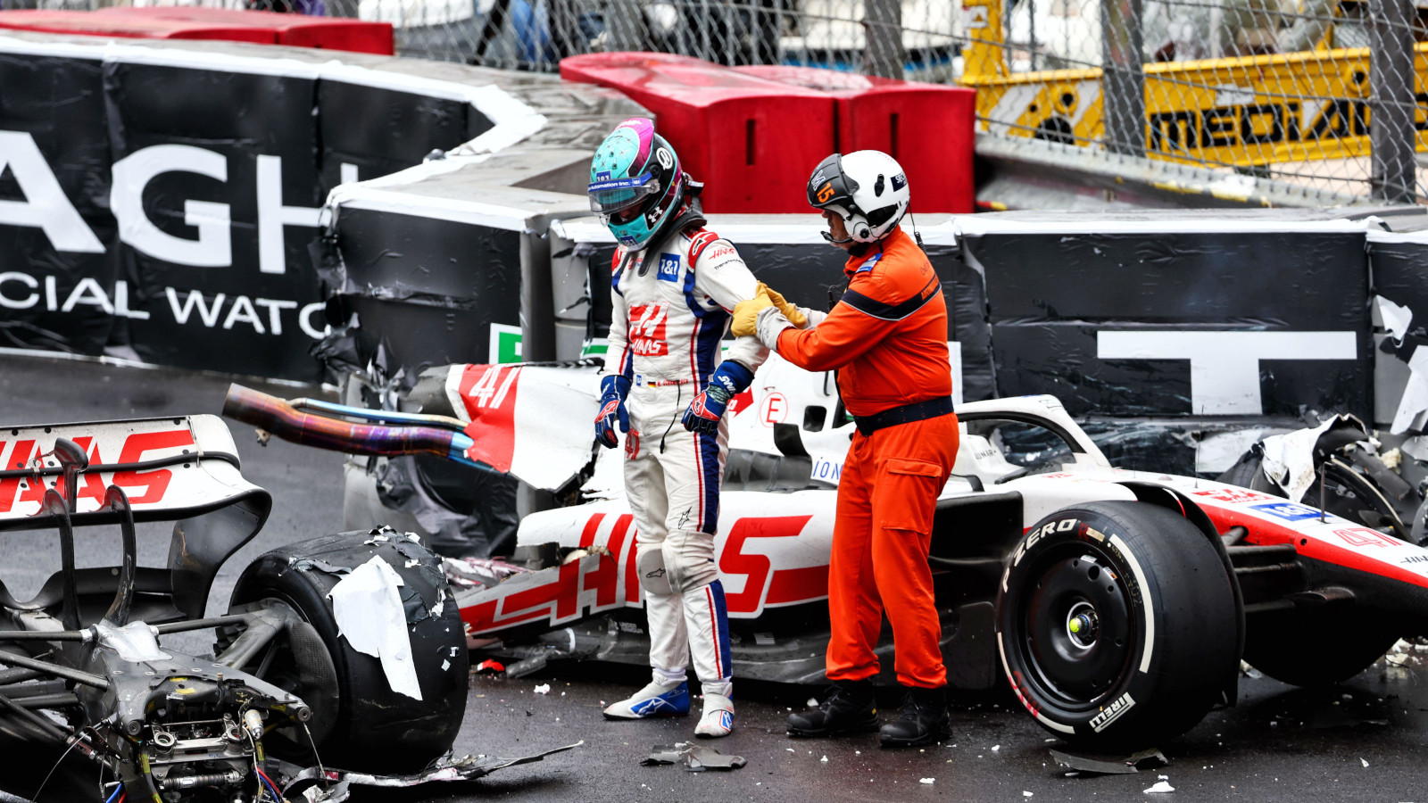 Mick Schumacher stands by the wreckage of his Haas car. Monte Carlo May 2022.