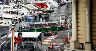Max Verstappen passes boats in the Monaco harbour. Monte Carlo May 2022.