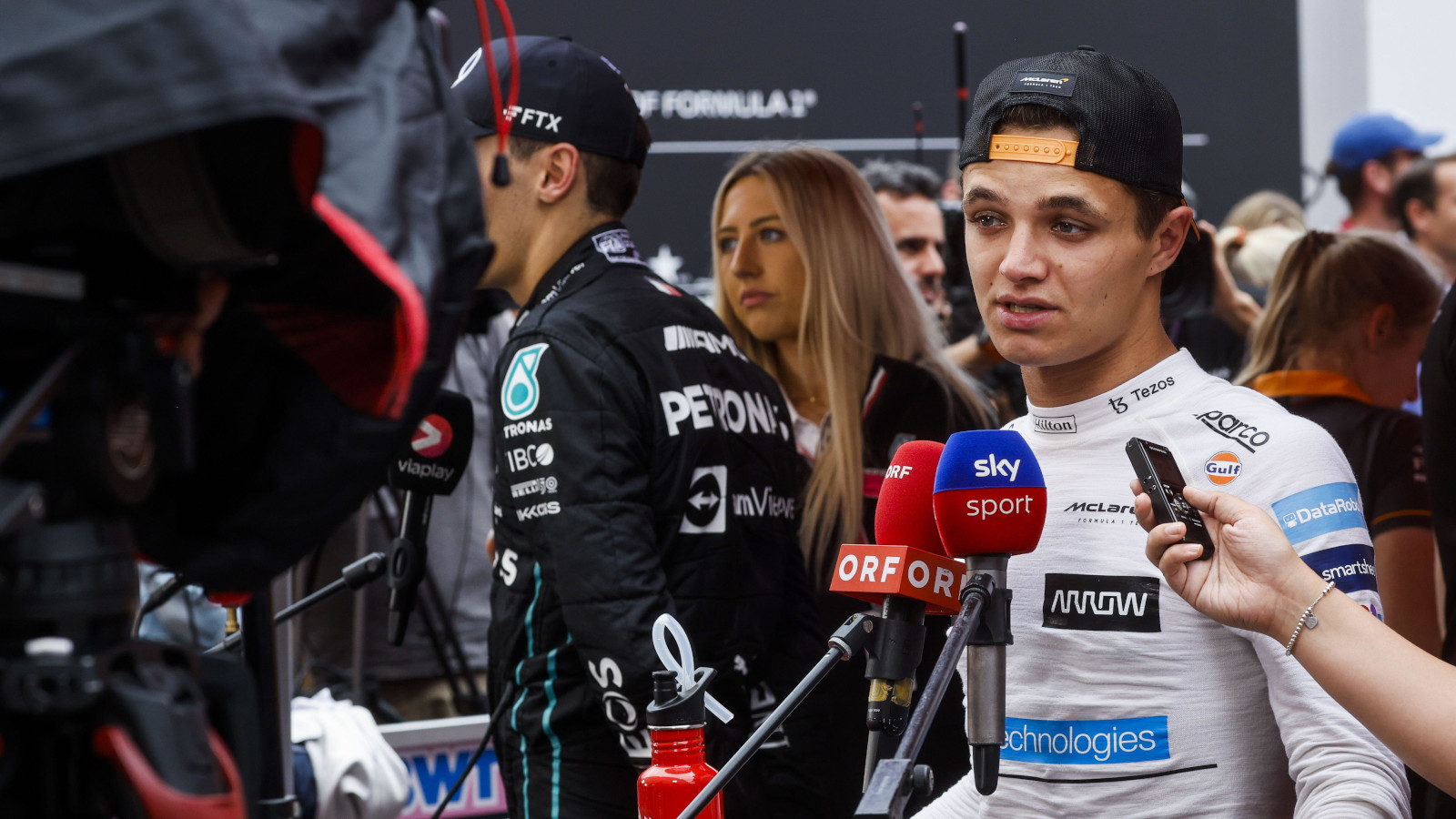 Lando Norris doing a TV interview in the bullpen. Monaco May 2022