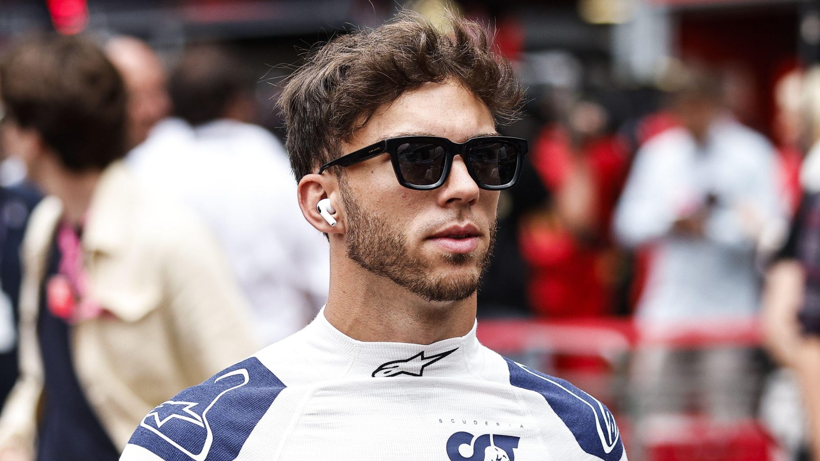 Pierre Gasly wearing sunglasses and headphones. Monaco, May 2022.