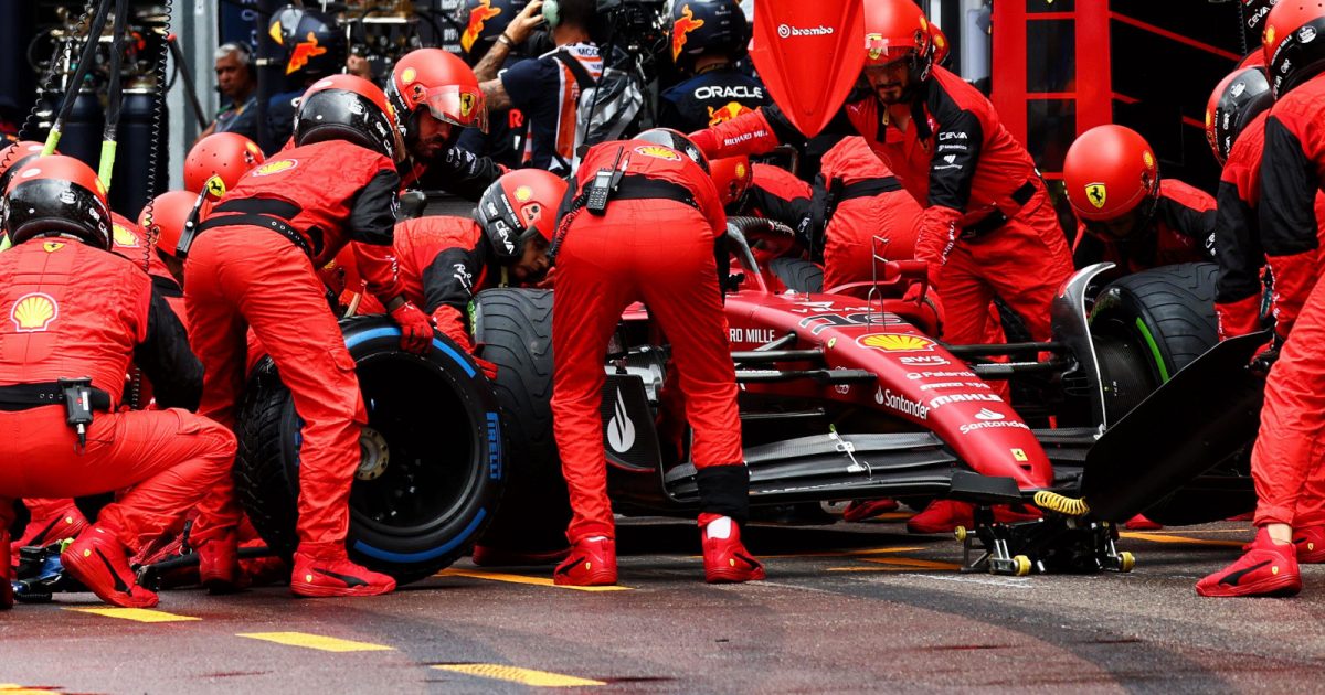 Charles Leclerc pits in his Ferrari garage to swap full wet tyres for intermediates. Monaco May 2022