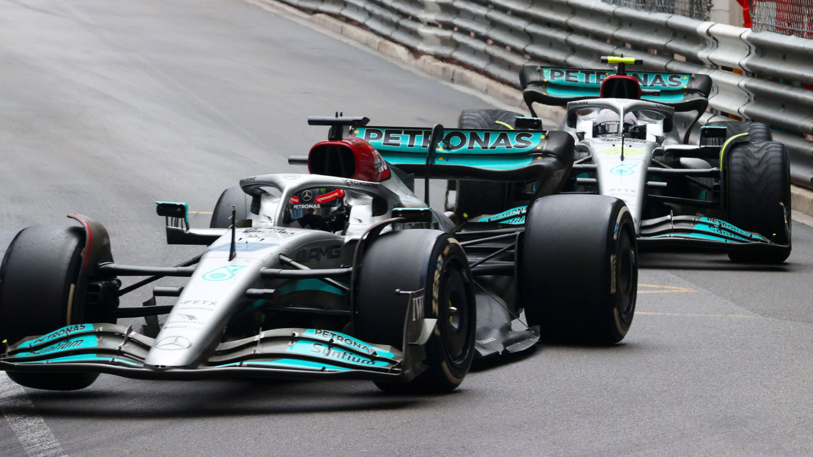 Mercedes pair George Russell on slick tyres leads Lewis Hamilton on wets. Monaco May 2022