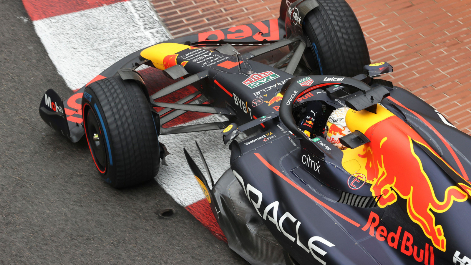 Max Verstappen on full wet tyres corners over the kerb in his Red Bull. Monaco May 2022