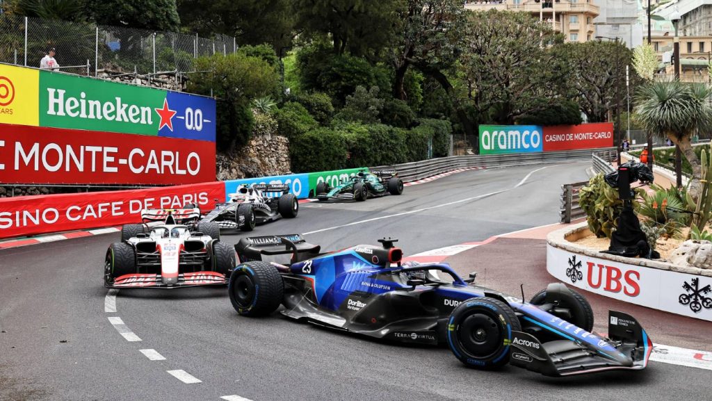 Williams driver Alex Albon heads a train of cars at the Monaco hairpin. Monte Carlo May 2022.