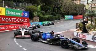 Williams driver Alex Albon heads a train of cars at the Monaco hairpin. Monte Carlo May 2022.