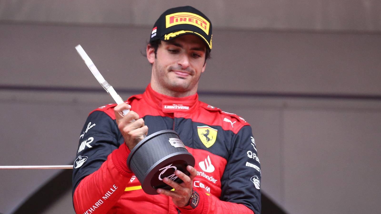 Carlos Sainz looking disappointed on the podium. Monaco May 2022.