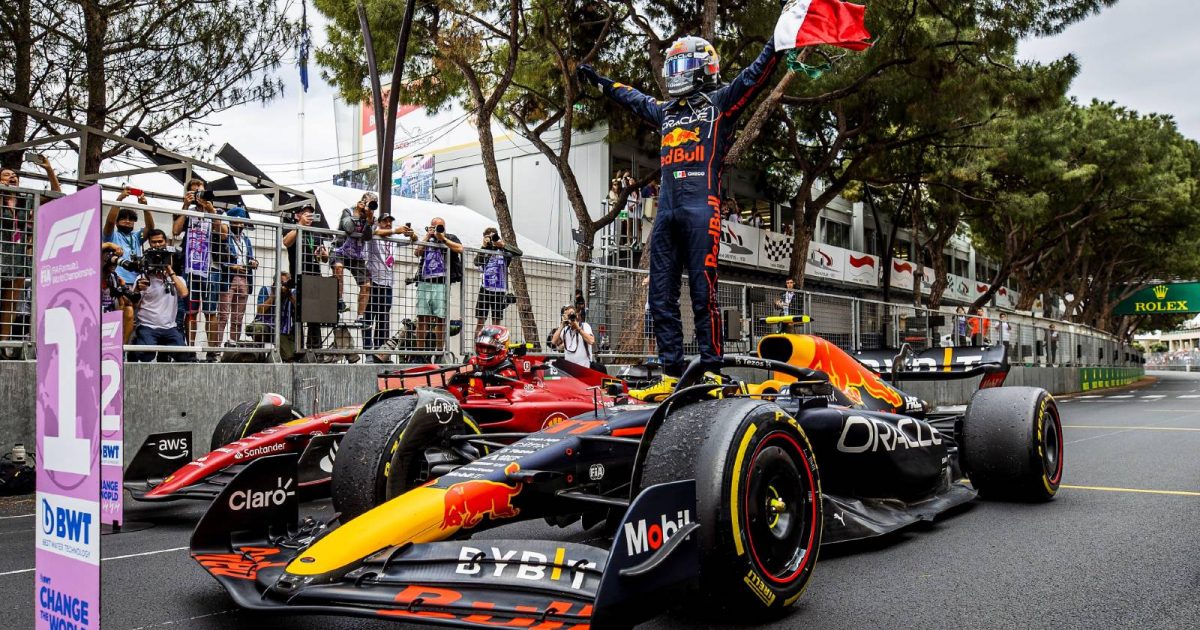 Sergio Perez celebrates by standing on his car. Monaco May 2022.