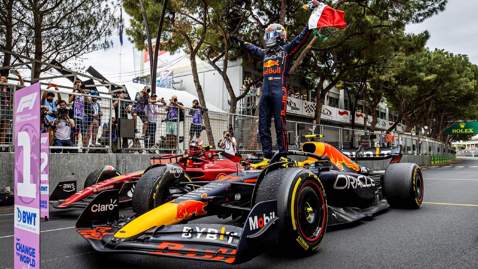 Sergio Perez celebrates by standing on his car. Monaco May 2022.