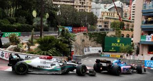Lewis Hamilton's Mercedes chases Fernando Alonso's Alpine. Monaco May 2022.