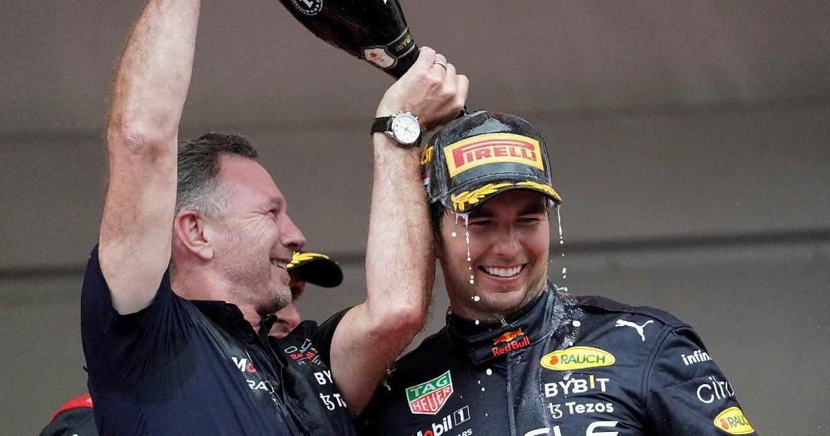 Christian Horner pours champagne on Sergio Perez . Monaco, May 2022.