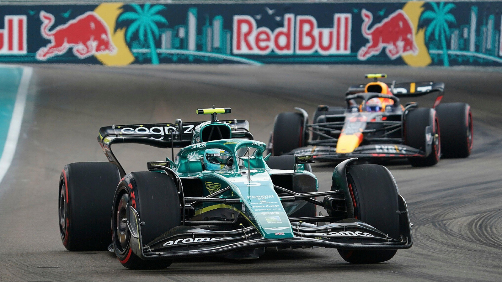 Aston Martin's Sebastian Vettel leads Red Bull's Sergio Perez in the Miami Grand Prix. Miami, May 2022.