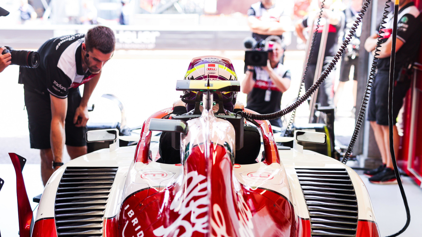 Zhou Guanya settling into his car. Monaco May 2022