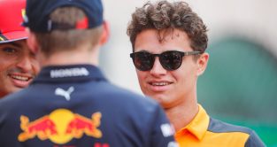 Lando Norris speaking with Max Verstappen and a smiling Carlos Sainz. Monaco May 2022