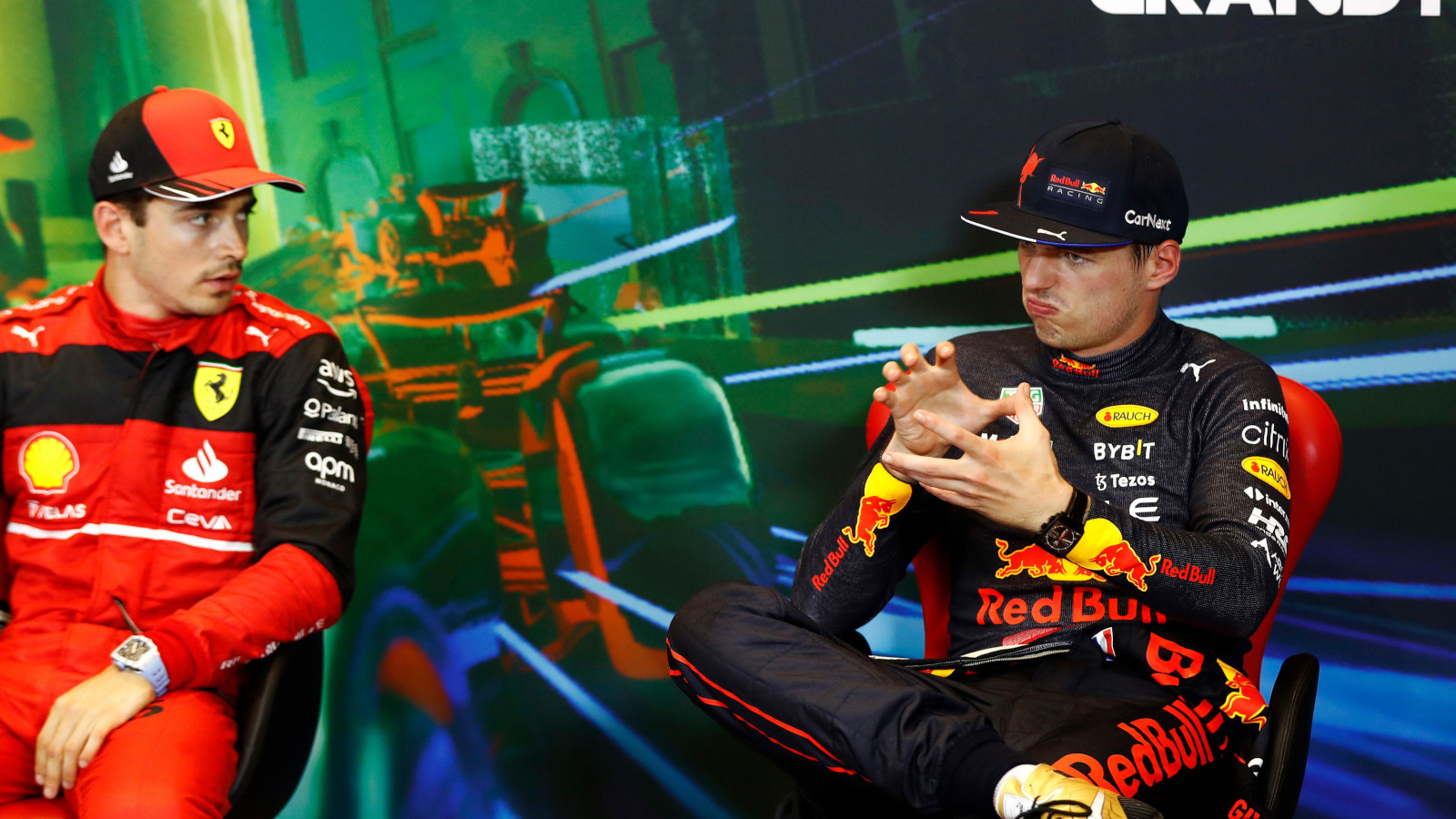 Max Verstappen explaining something to Charles Leclerc in the press conference. Baku June 2022