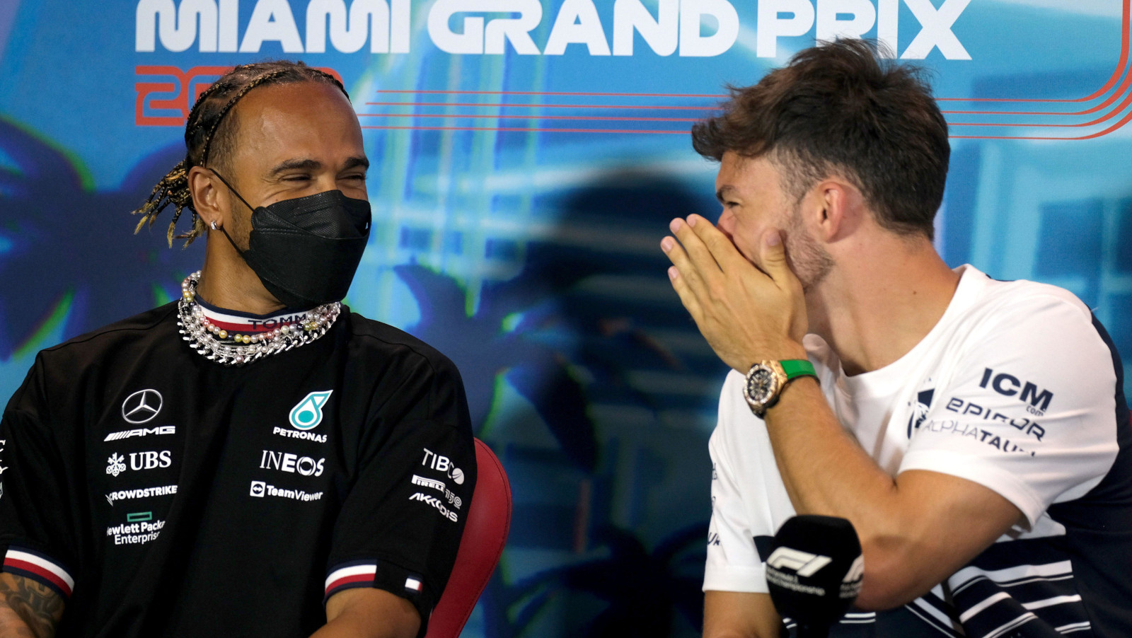Pierre Gasly whispers to Lewis Hamilton. Miami May 2022