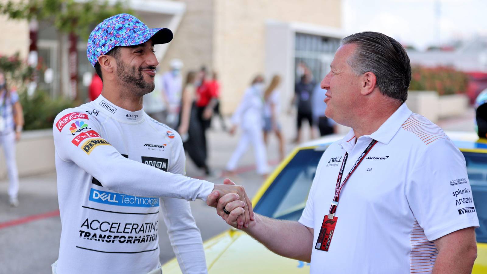 Daniel Ricciardo and Zak Brown shake hands. Austin October 2021.