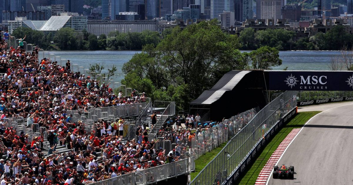 Max Verstappen's Red Bull passes a grandstand at the Canadian GP. Montreal June 2022.
