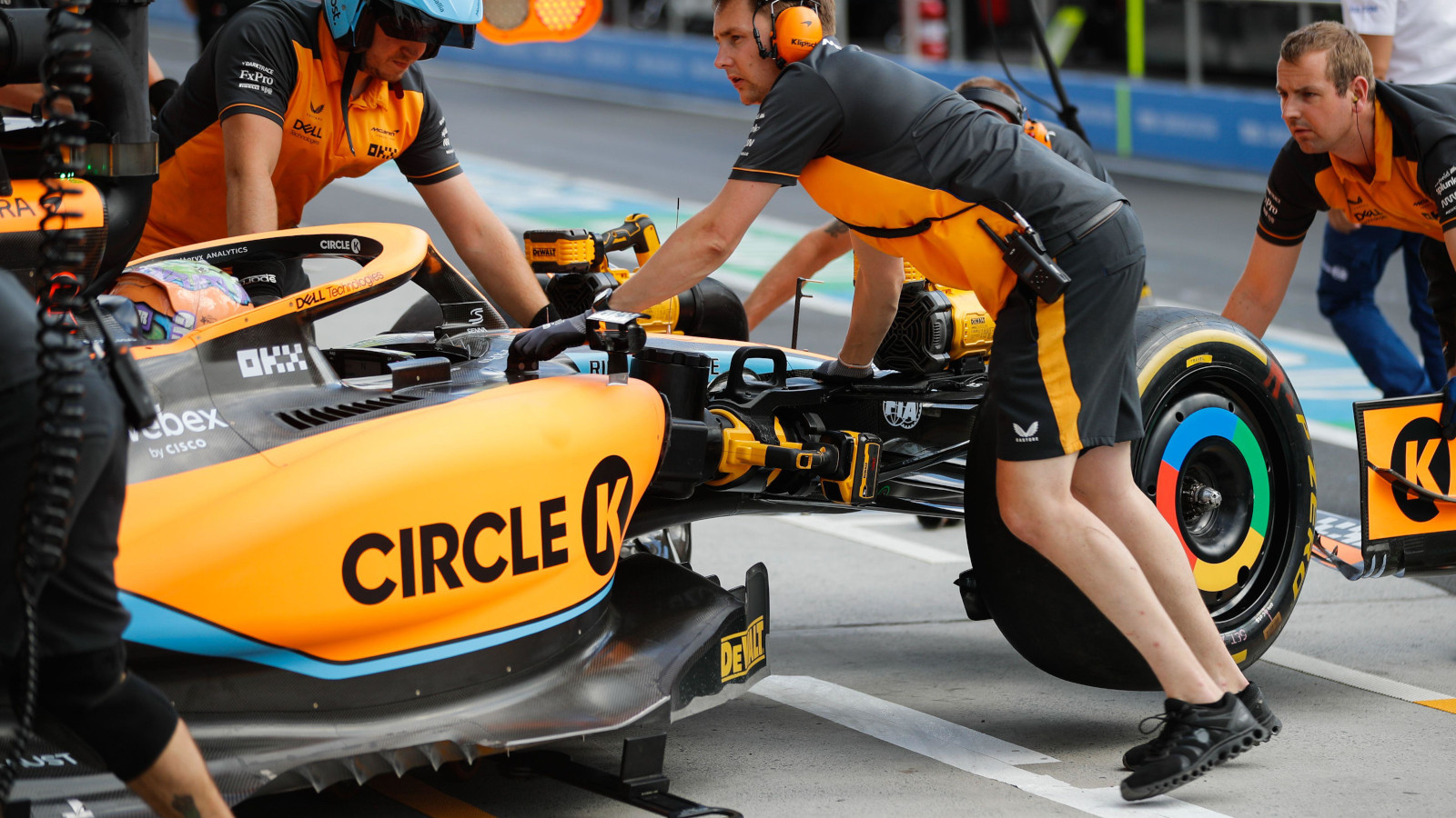 Daniel Ricciardo pushed back into the garage by three mechanics. Montreal June 2022