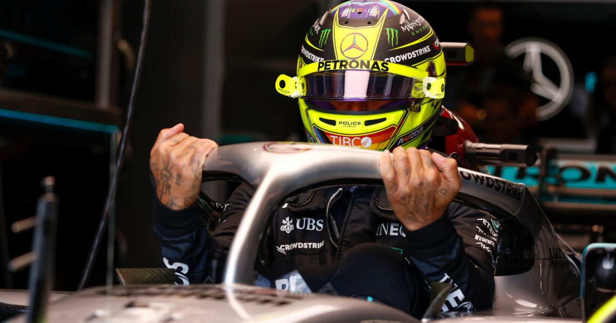 Lewis Hamilton holds onto Halo as he climbs out of his W13. Montreal June 2022