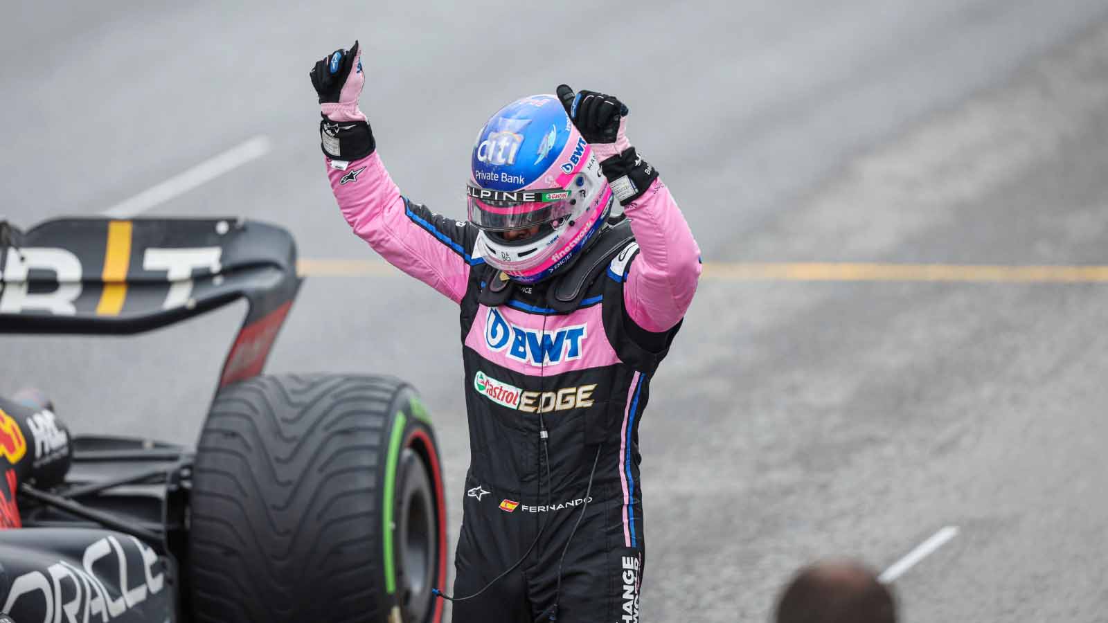 Fernando Alonso holds his hands up. Montreal June 2022.