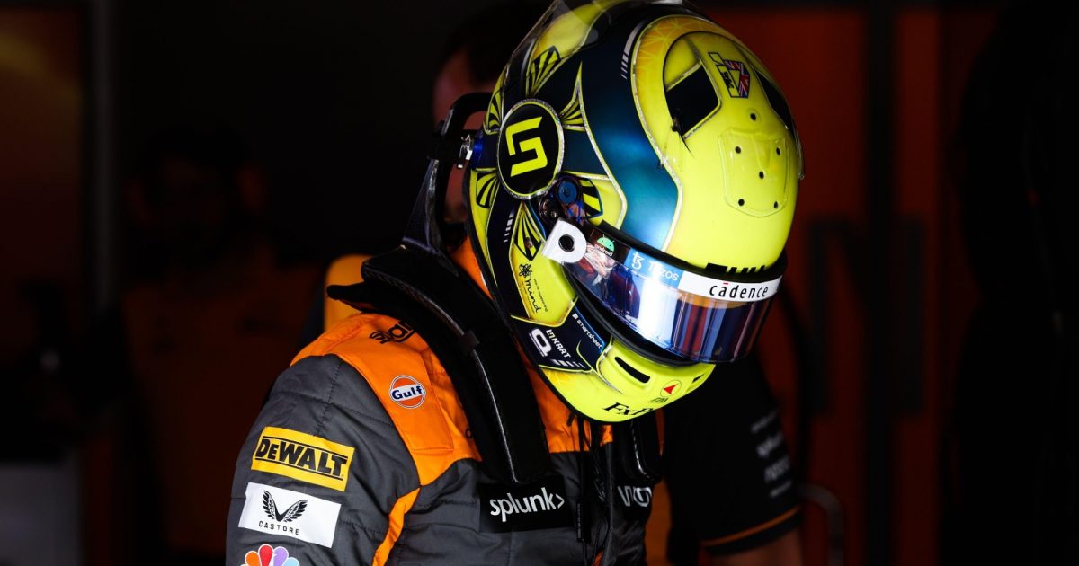 Lando Norris wears his race gear in the McLaren garage. Canada, June 2022.