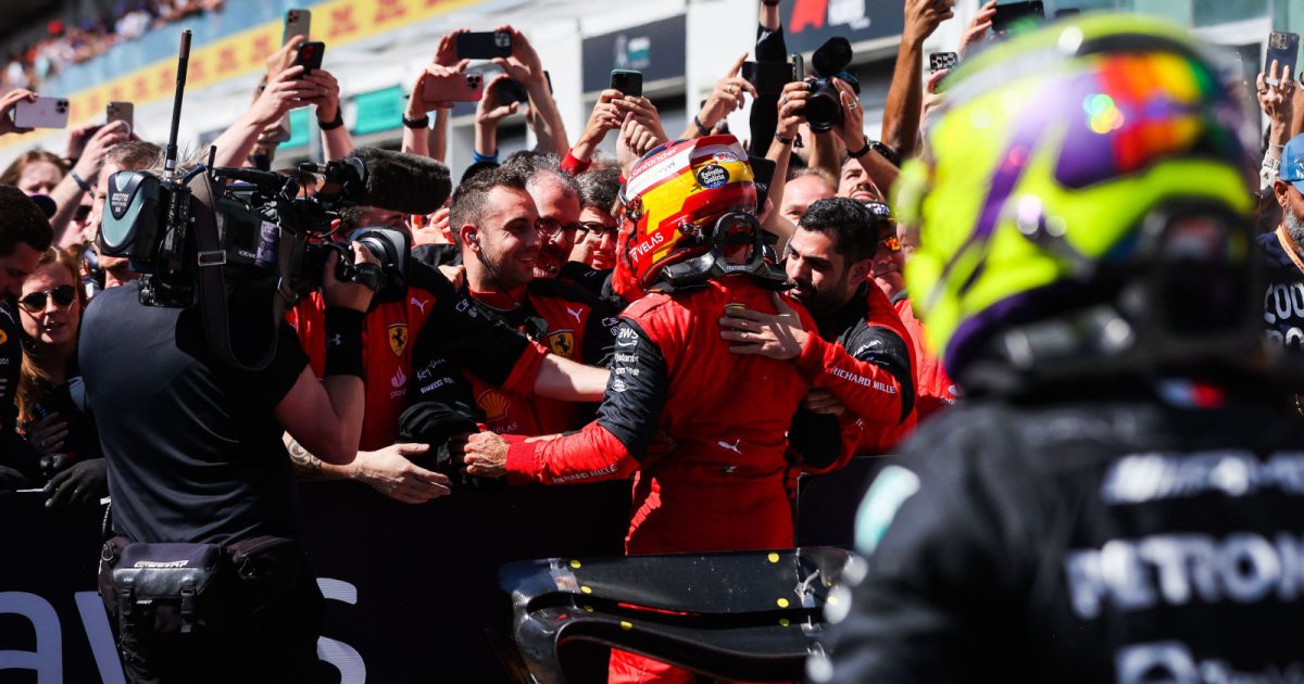 Carlos Sainz celebrates with Ferrari, Lewis Hamilton in the foreground. Montreal June 2022
