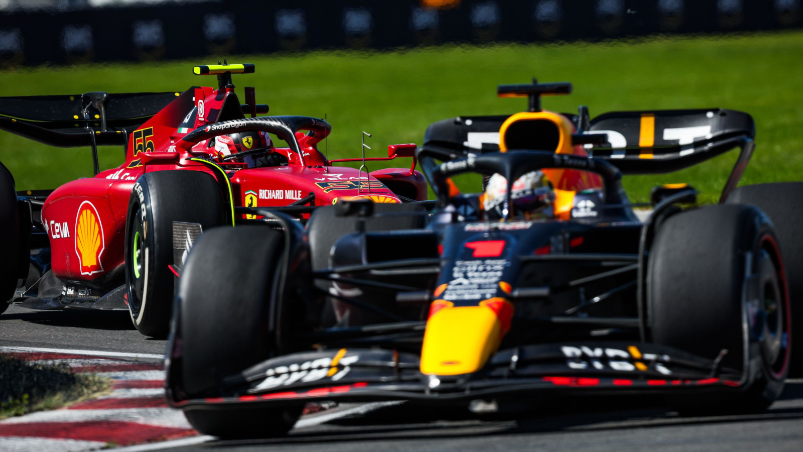 Max Verstappen, Red Bull, chased by Carlos Sainz, Ferrari. Montreal June 2022