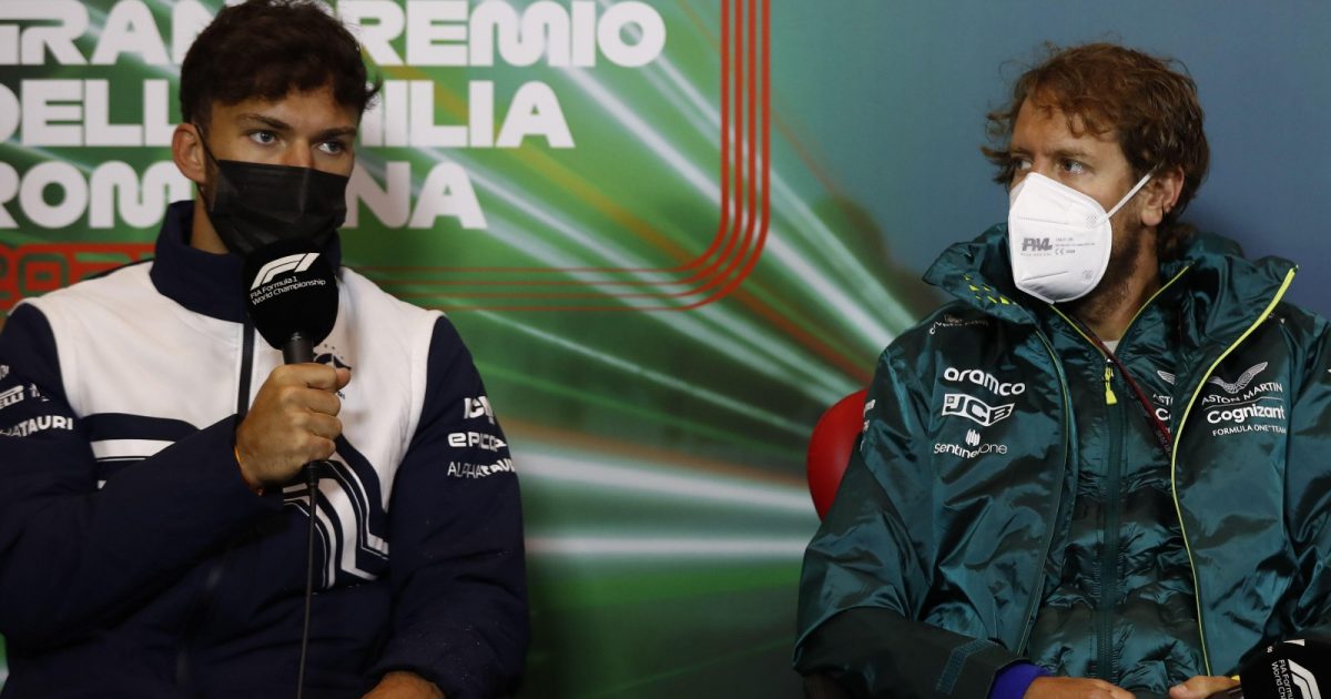 Sebastian Vettel listens while PIerre Gasly speaks. Imola, April 2022.