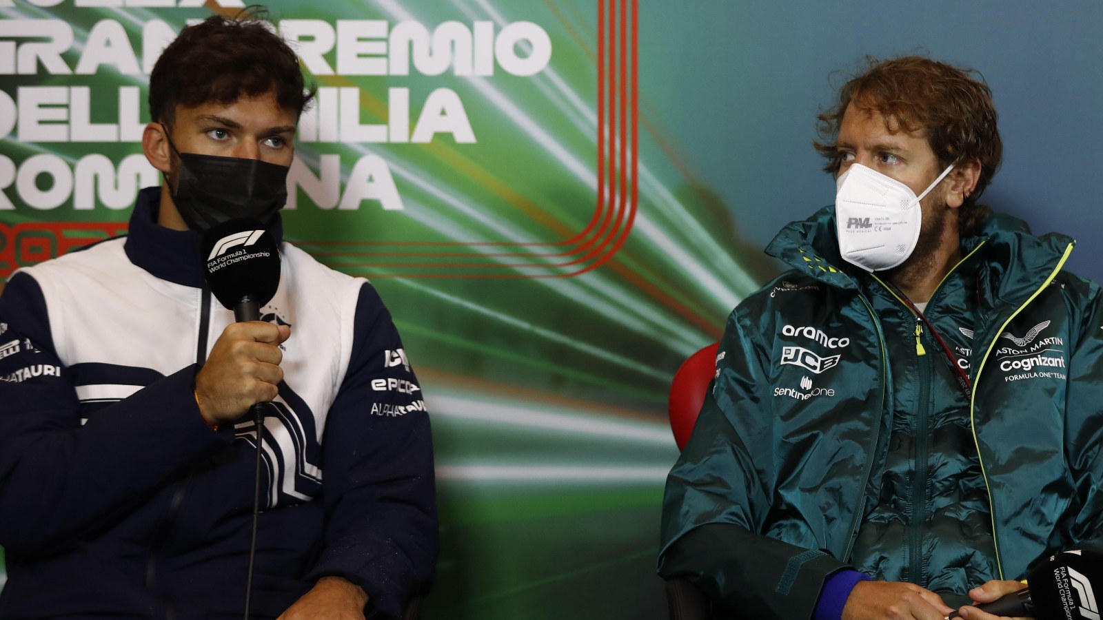 Sebastian Vettel listens while PIerre Gasly speaks. Imola, April 2022.