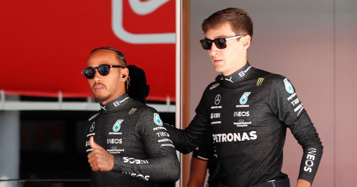 George Russell with his hand on Lewis Hamilton's back. Spain May 2022