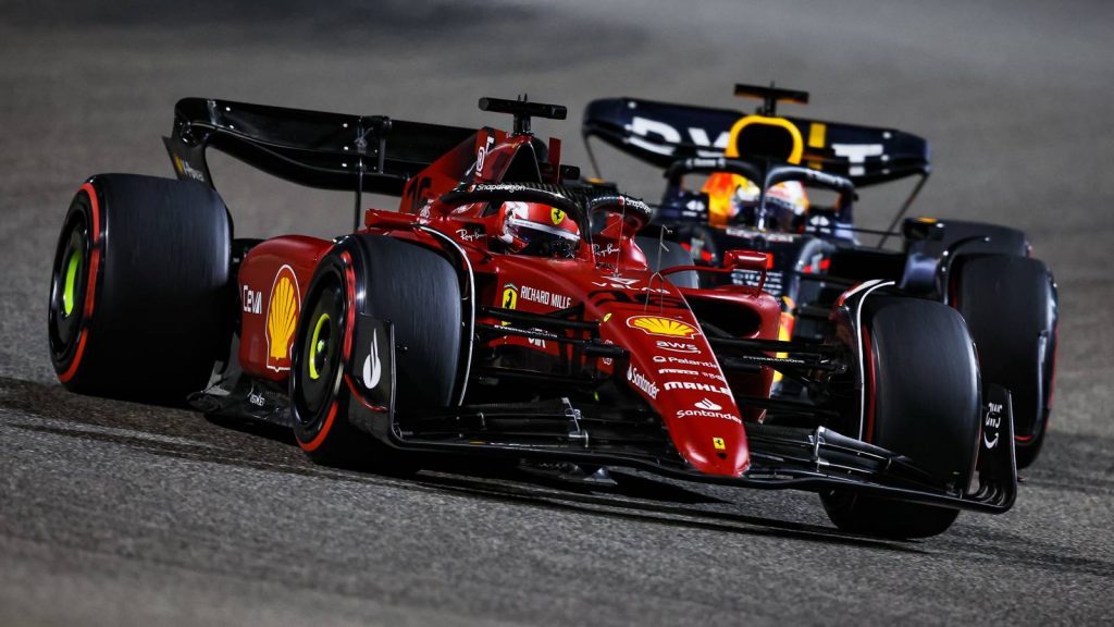 Charles Leclerc racing against Max Verstappen for the lead. Bahrain March 2022