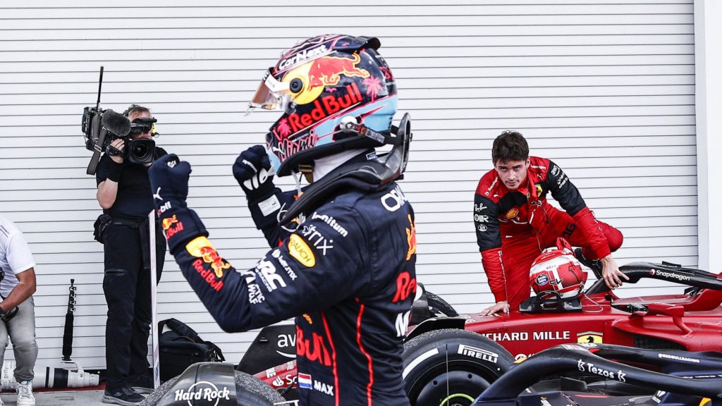 Max Verstappen with a fist bump, Charles Leclerc watches on. Miami May 2022