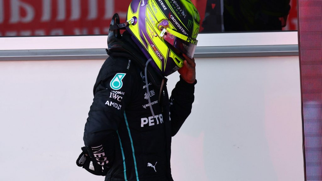 Lewis Hamilton with his hand on his sore back. Baku June 2022