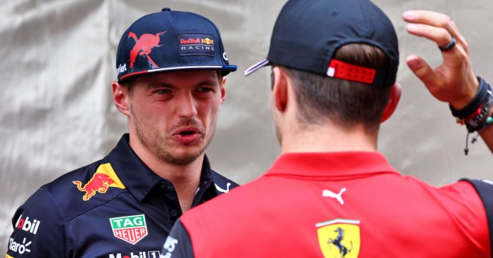 Max Verstappen pulls a face as he speaks with Charles Leclerc. Monaco May 2022