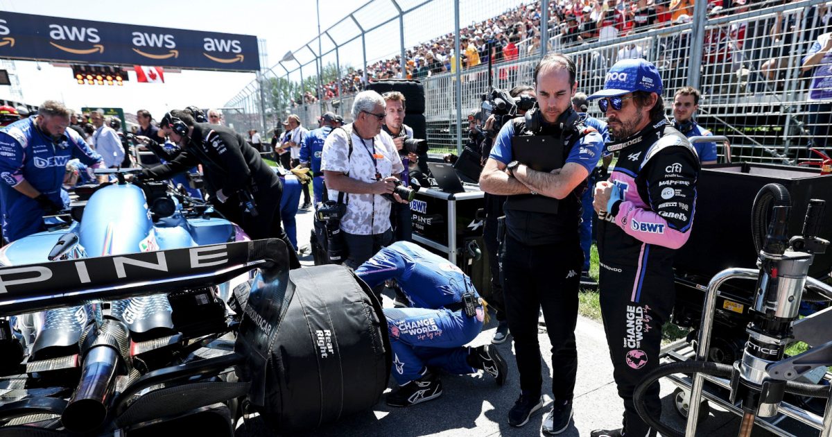 Fernando Alonso on the grid as he mechanics do last minute work on his car. Canada June 2022