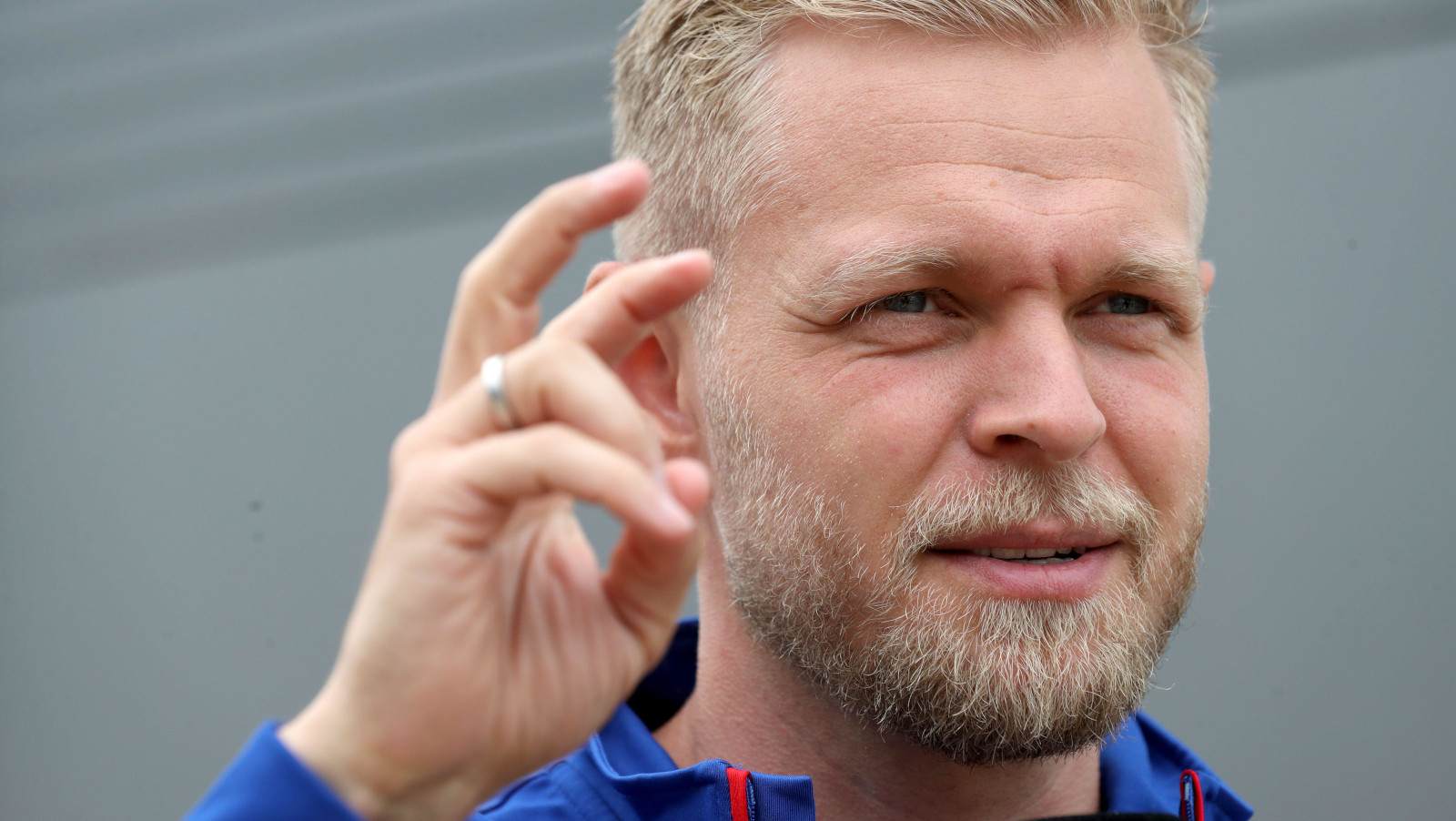 Haas' Kevin Magnussen in the paddock, hand gesture. Silverstone July 2022