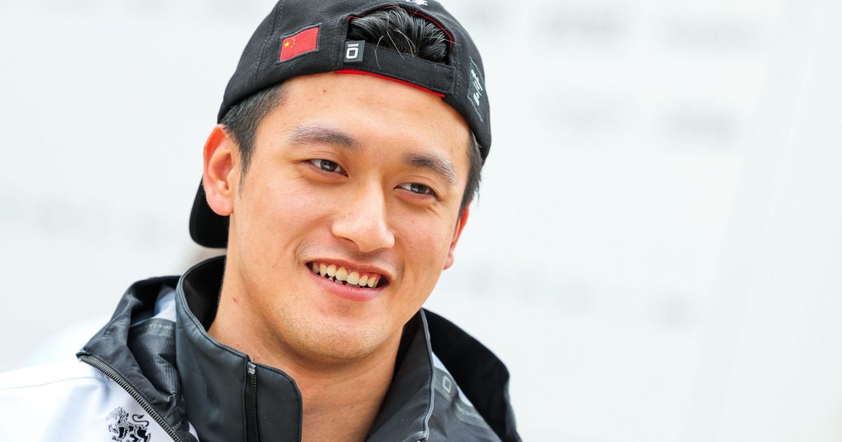 Zhou Guanyu with his cap on backwards, smiling. Britain July 2022