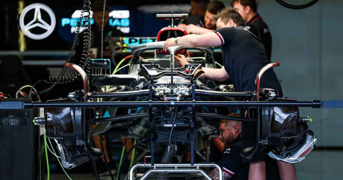 Mercedes mechanics work on the car. Silverstone July 2022.