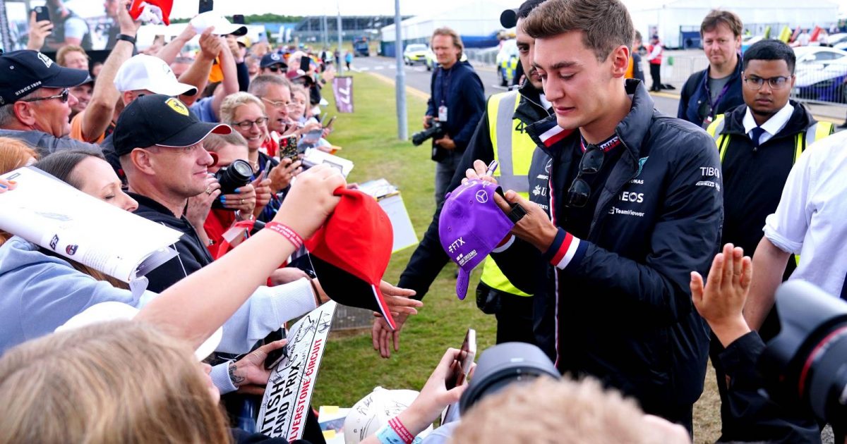 George Russell, Mercedes, interacts with fans at Silverstone. England, July 2022.