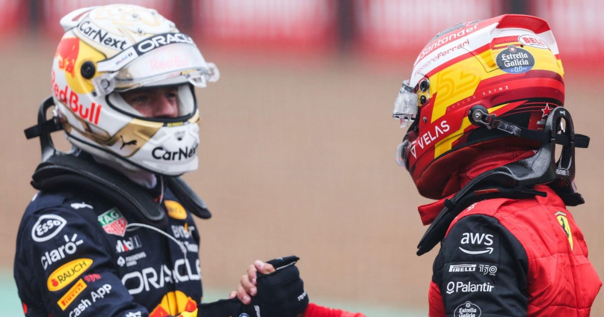 Max Verstappen and Carlos Sainz shake hands. Silverstone, July 2022.