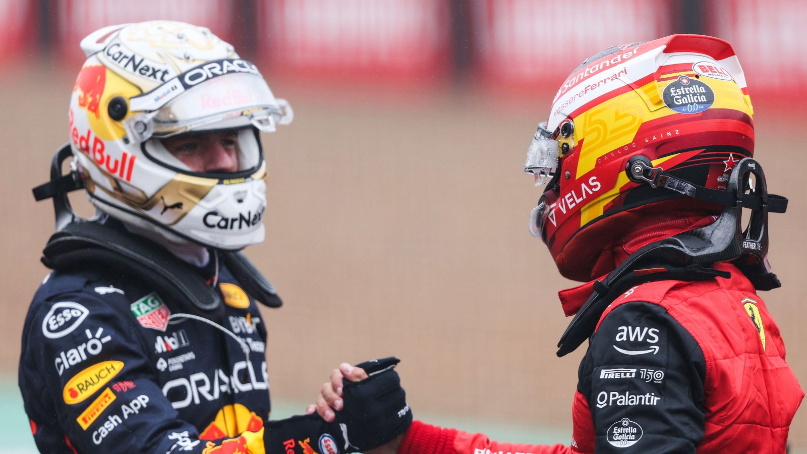 Max Verstappen and Carlos Sainz shake hands. Silverstone, July 2022.