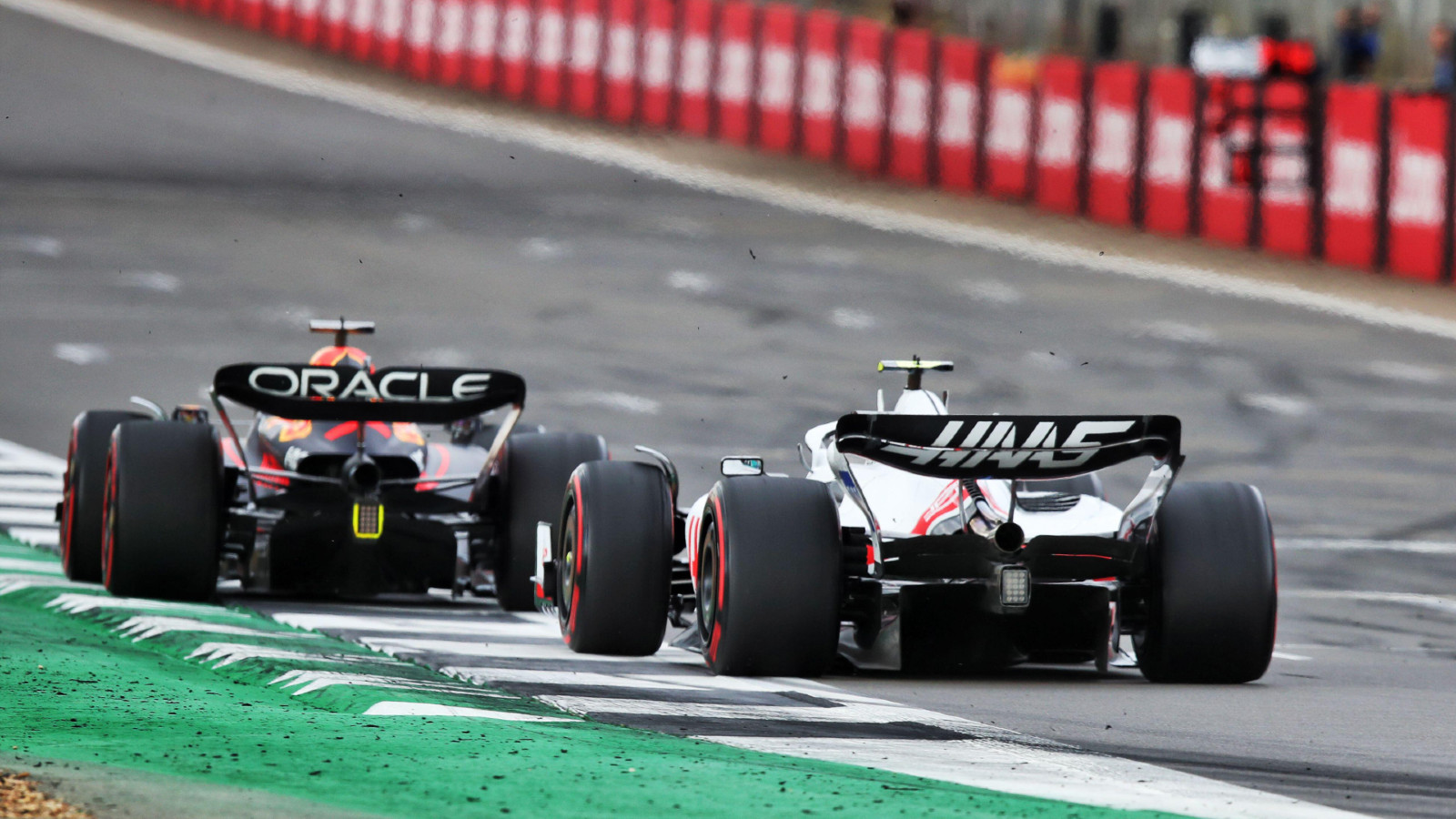 Haas' Mick Schumacher chasing Red Bull's Max Verstappen at the British Grand Prix. Silverstone, July 2022.