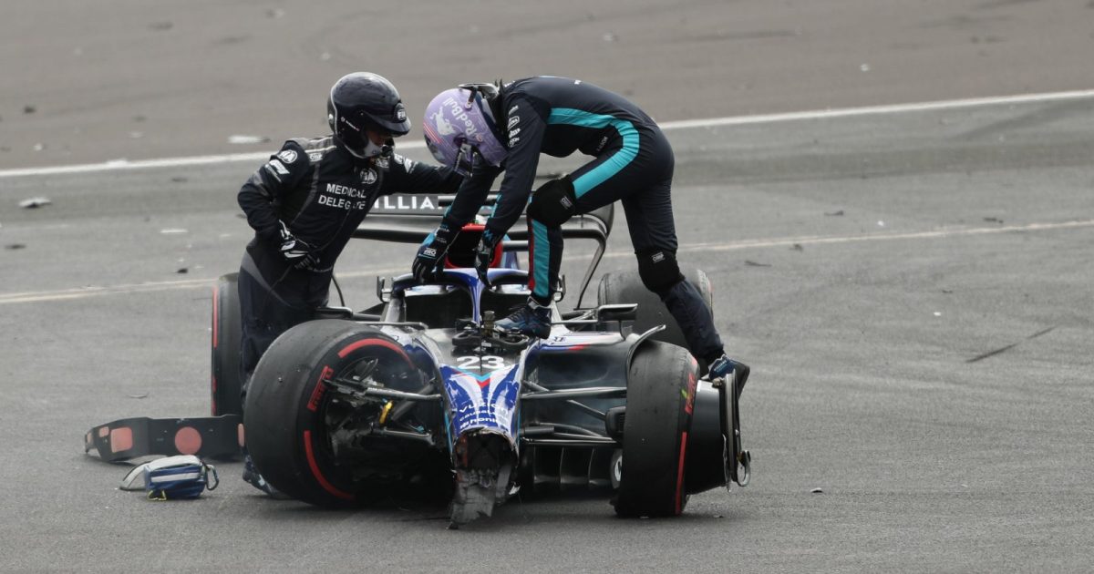 Alex Albon climbs out of his car. Silverstone, July 2022.