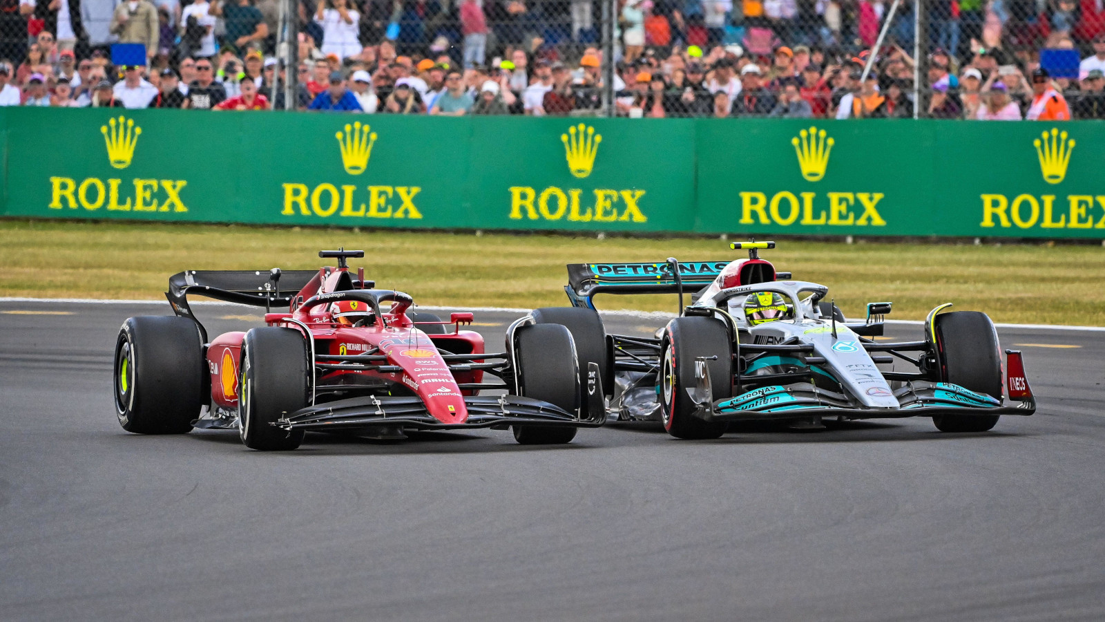 Charles Leclerc racing Mercedes driver Lewis Hamilton. Silverstone July 2022