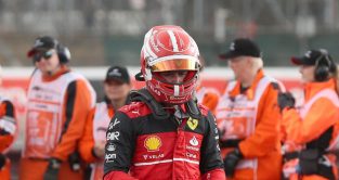 Charles Leclerc after the British Grand Prix, walking past marshals. Silverstone July 2022