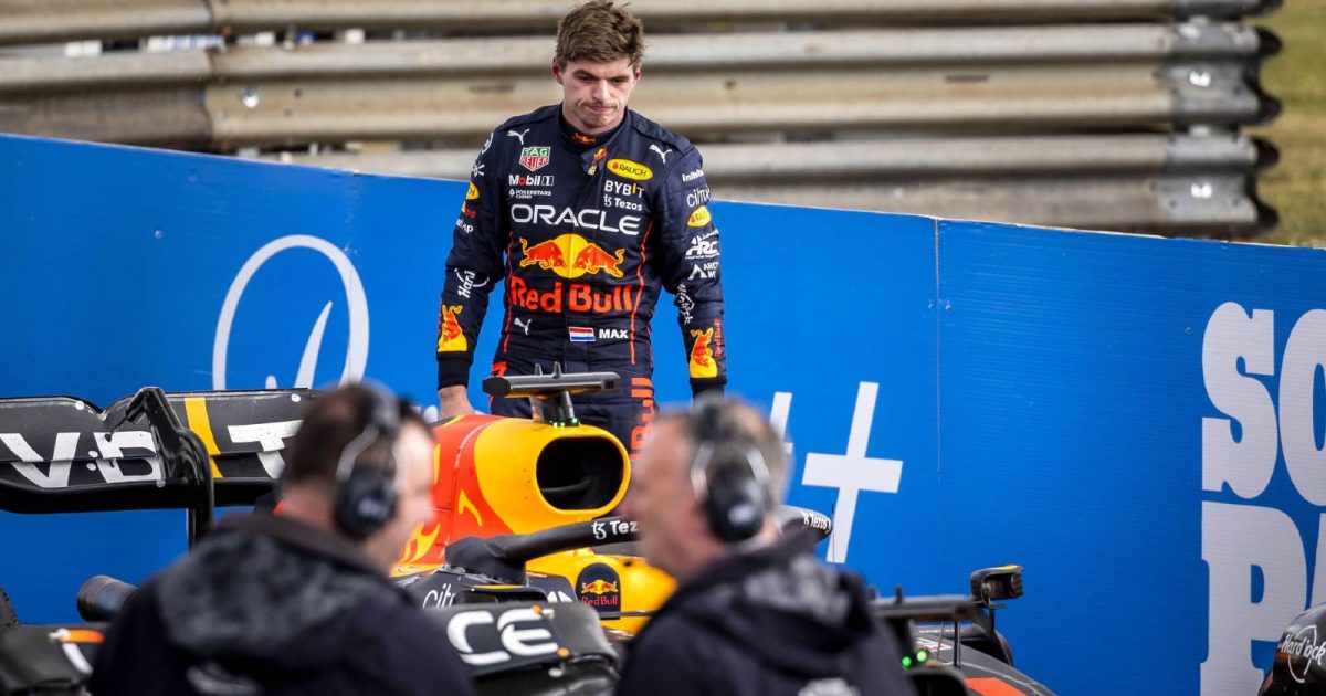 Max Verstappen looks ruefully at his Red Bull car. Silverstone July 2022.