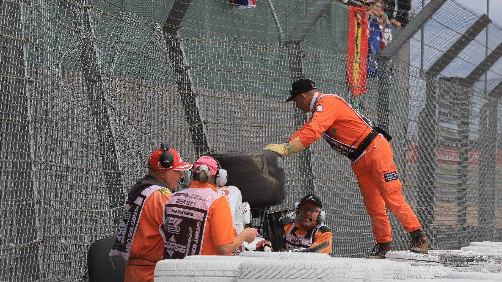 Marshals attend Zhou Guanyus stricken car planetF1