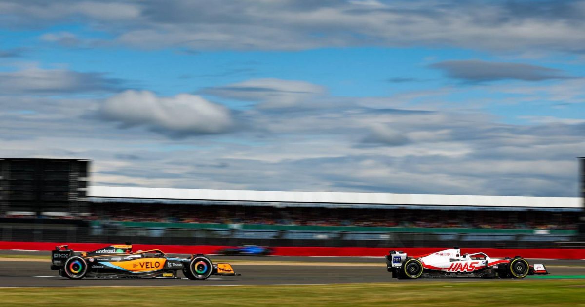 Daniel Ricciardo chasing a Haas during the British GP. Silverstone July 2022.